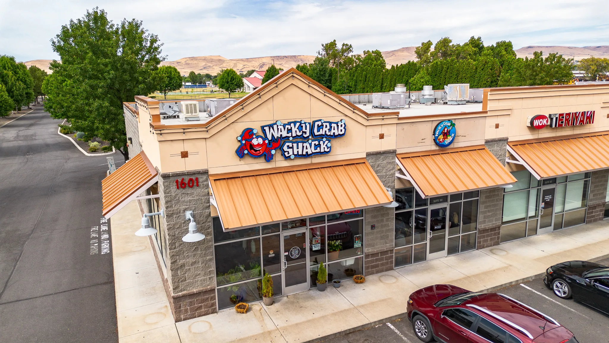Aerial view of Wacky Crab Shack in Union Gap, WA, with sunny skies over the Yakima Valley